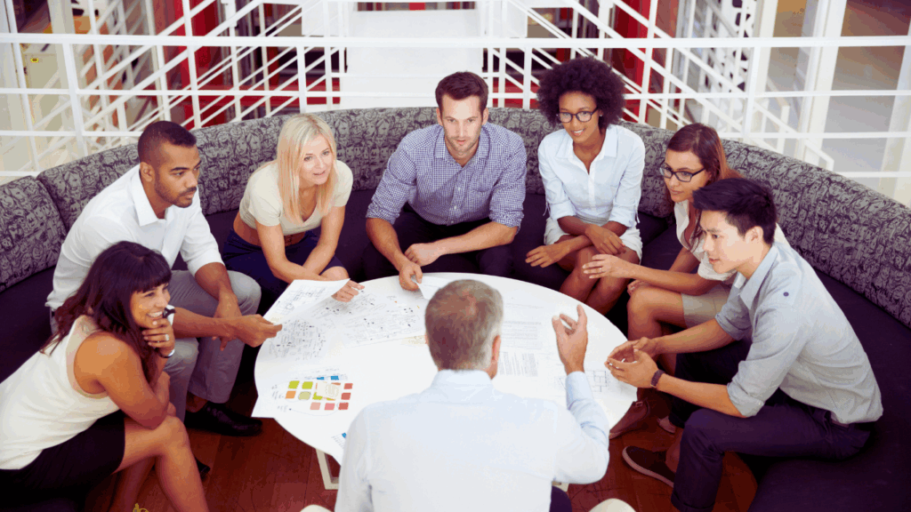 business outgrown organizational structure — business owner reviewing organizational chart with small leadership team