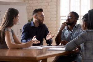 what does a business consultant do — consultant meeting with small business leadership team